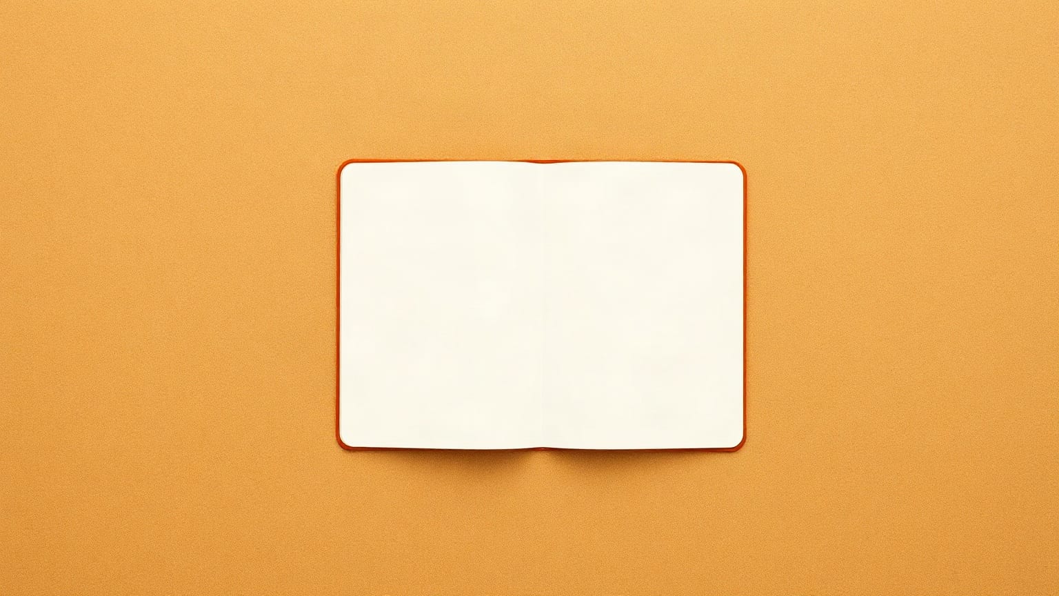 A passport booklet lying open on warm sand, both pages blank